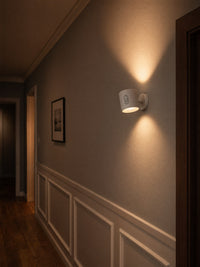 Loft sconces lining hallway corridor, architectural lighting