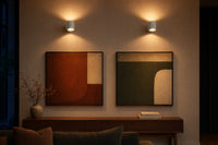 Pair of Loft sconces flanking framed wall art